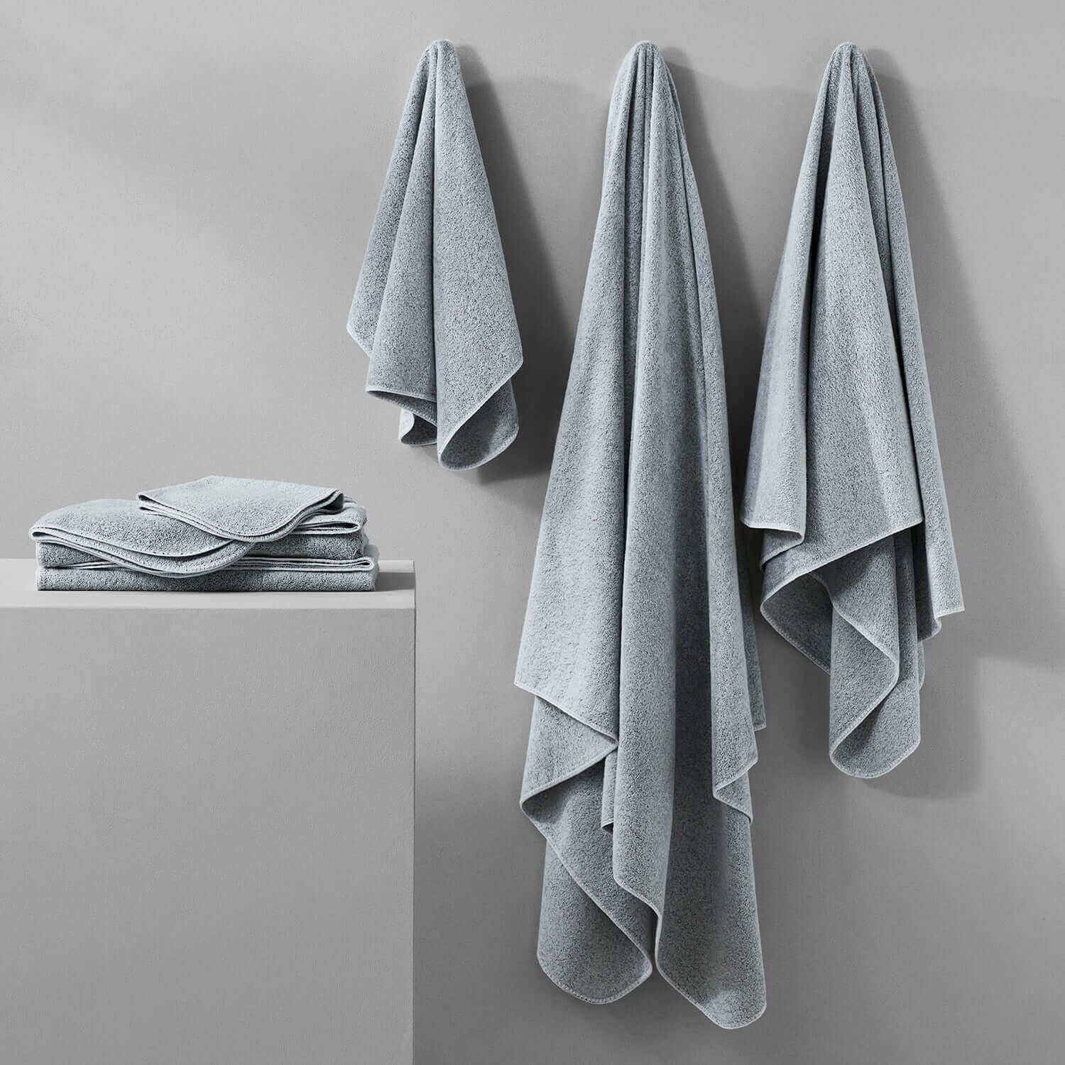 Tuxedo Towel Collection in Millennial Grey, showcasing vibrant multi-tonal hues and chlorine-compatible colors.