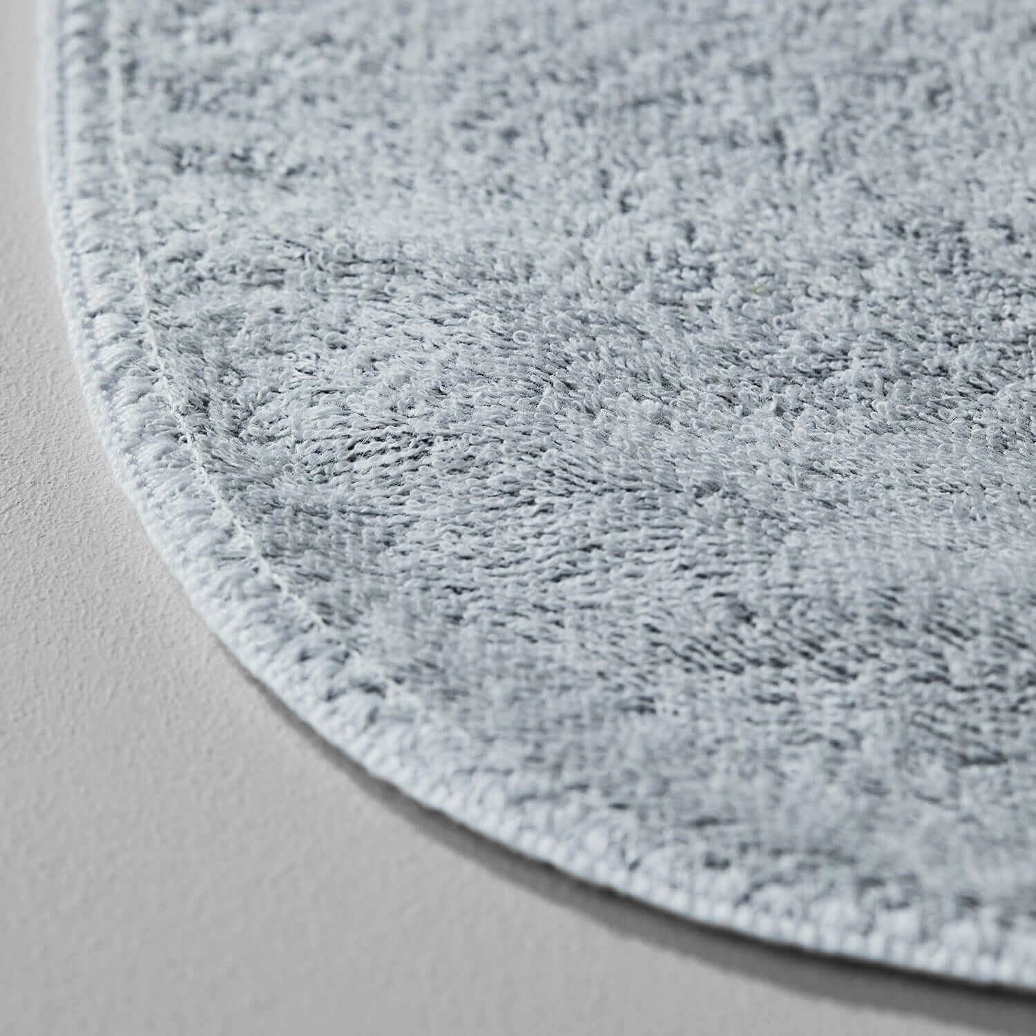 Close-up of Tuxedo Towel in Millennial Grey, showcasing its soft texture and durable edge.