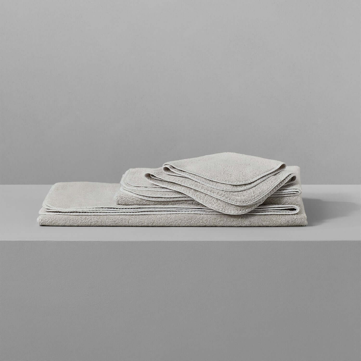 Tuxedo Collection Sand towels in soft, multi-tonal hues, chlorine-compatible, perfect for vibrant bathroom aesthetics.