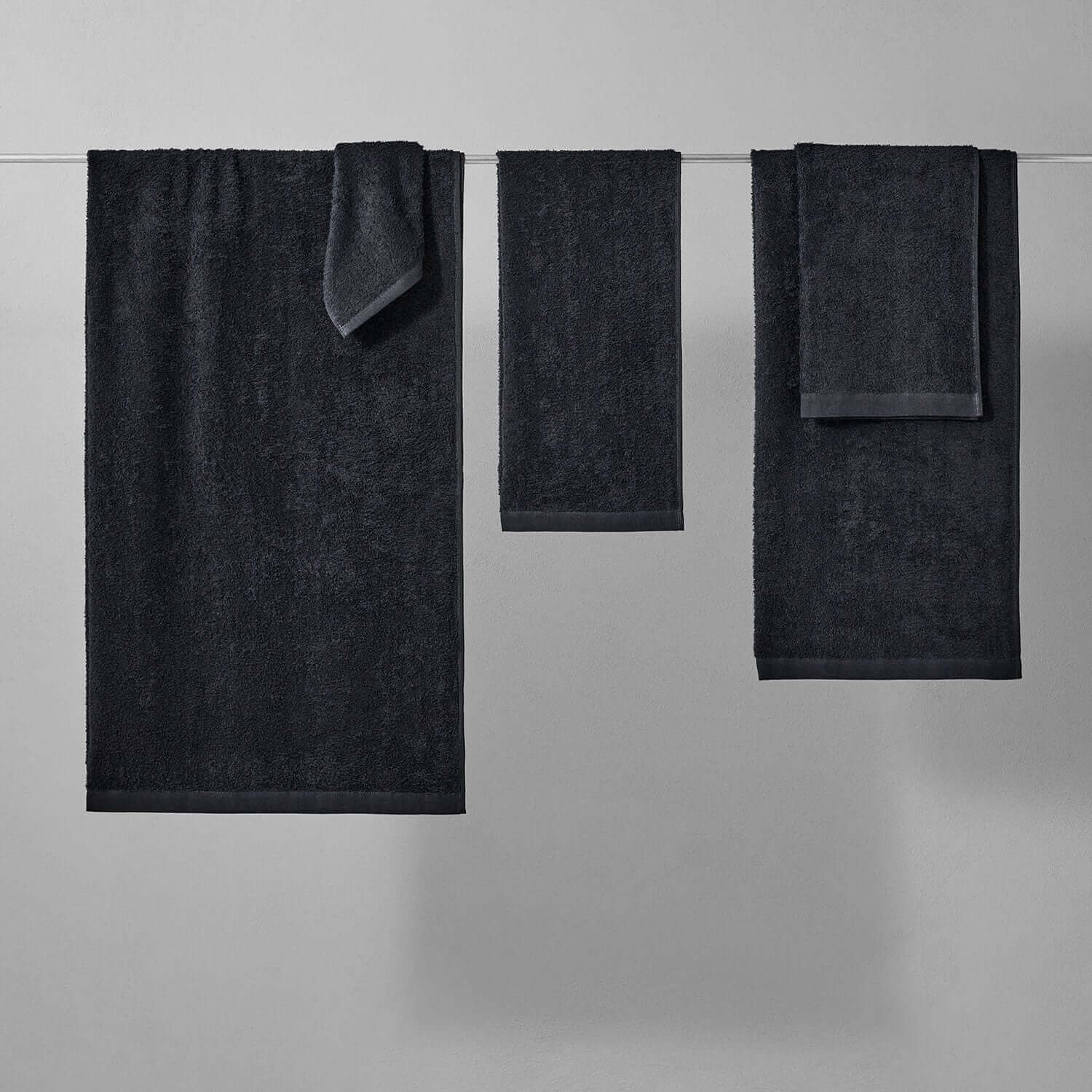 Wabi Sabi black towels displayed, showcasing minimalist design and luxurious texture for wholesale.