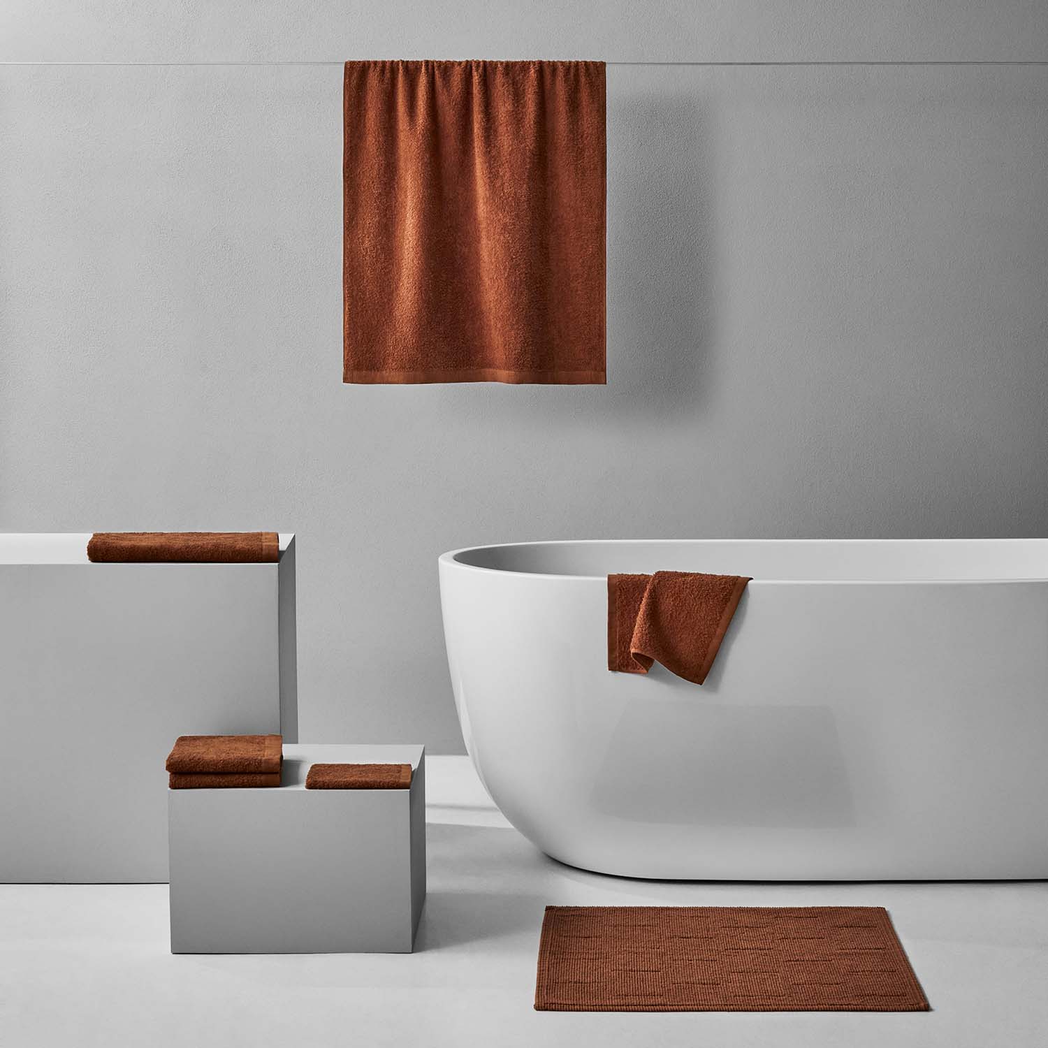 Wabi Sabi Bath Bundle Copper displayed in an elegant bathroom setting with copper towels and minimalist decor.