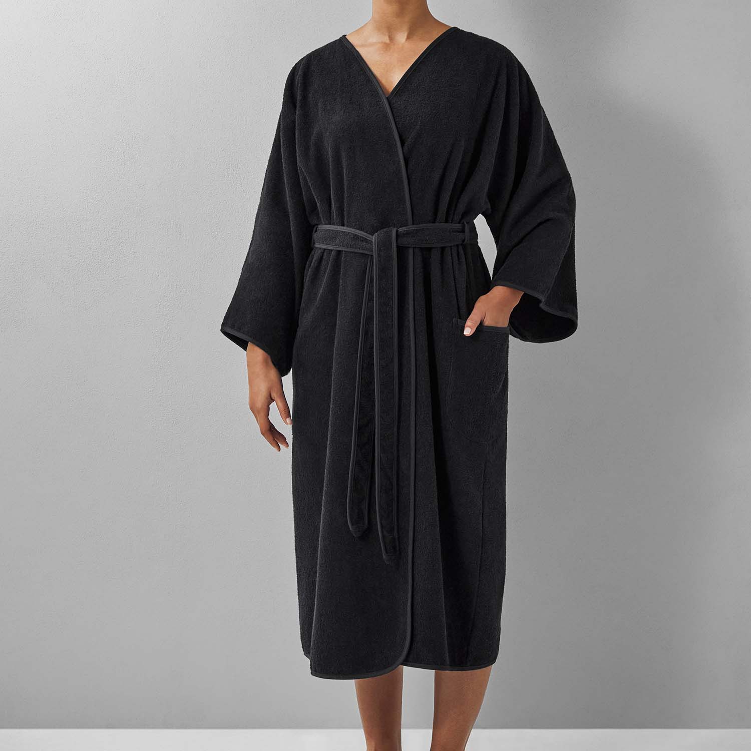 Wabi Sabi black robe featuring minimalist design and sustainable luxury with a serene aesthetic.