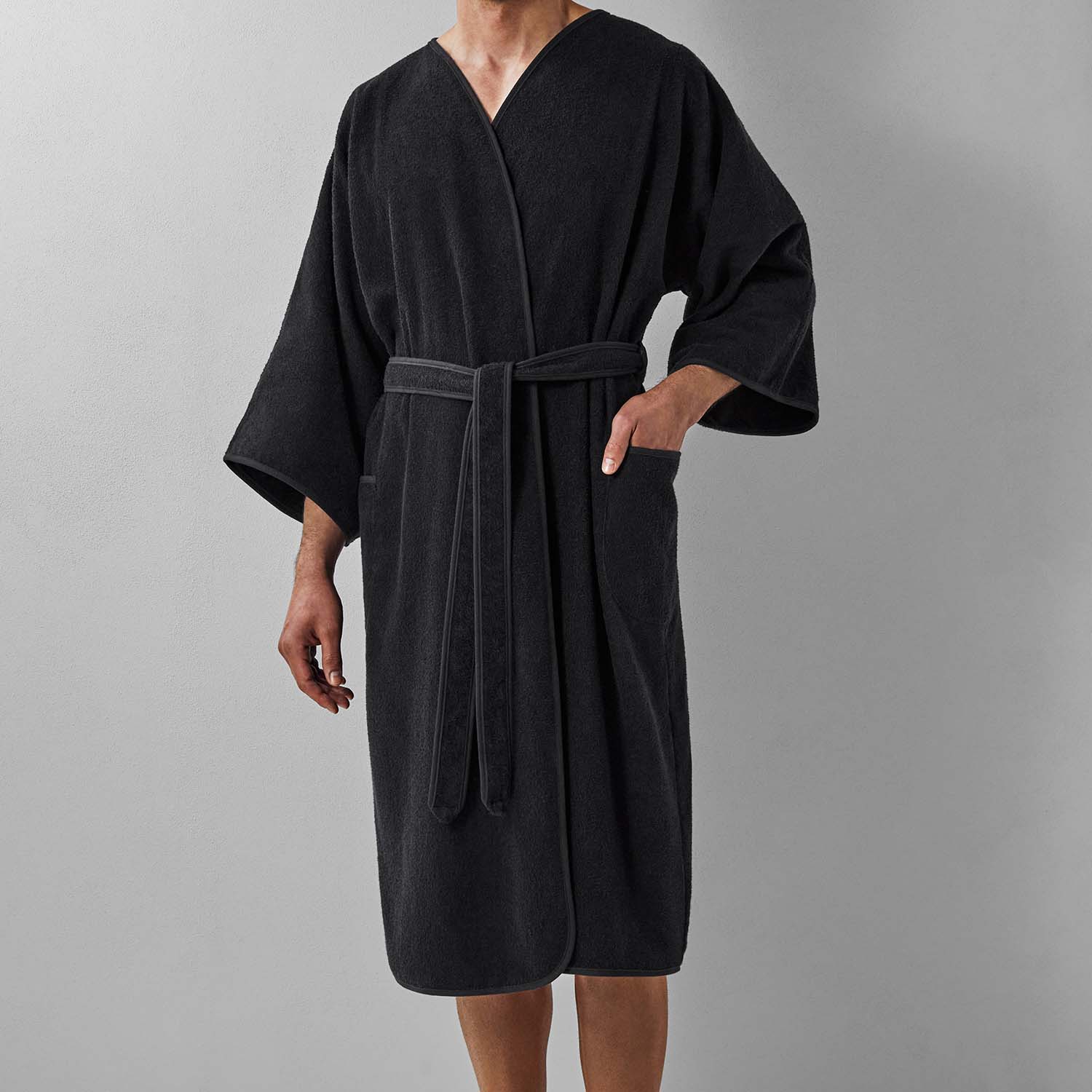 Wabi Sabi Black Robe featuring minimalist design with belt, emphasizing sustainable luxury and timeless craftsmanship.