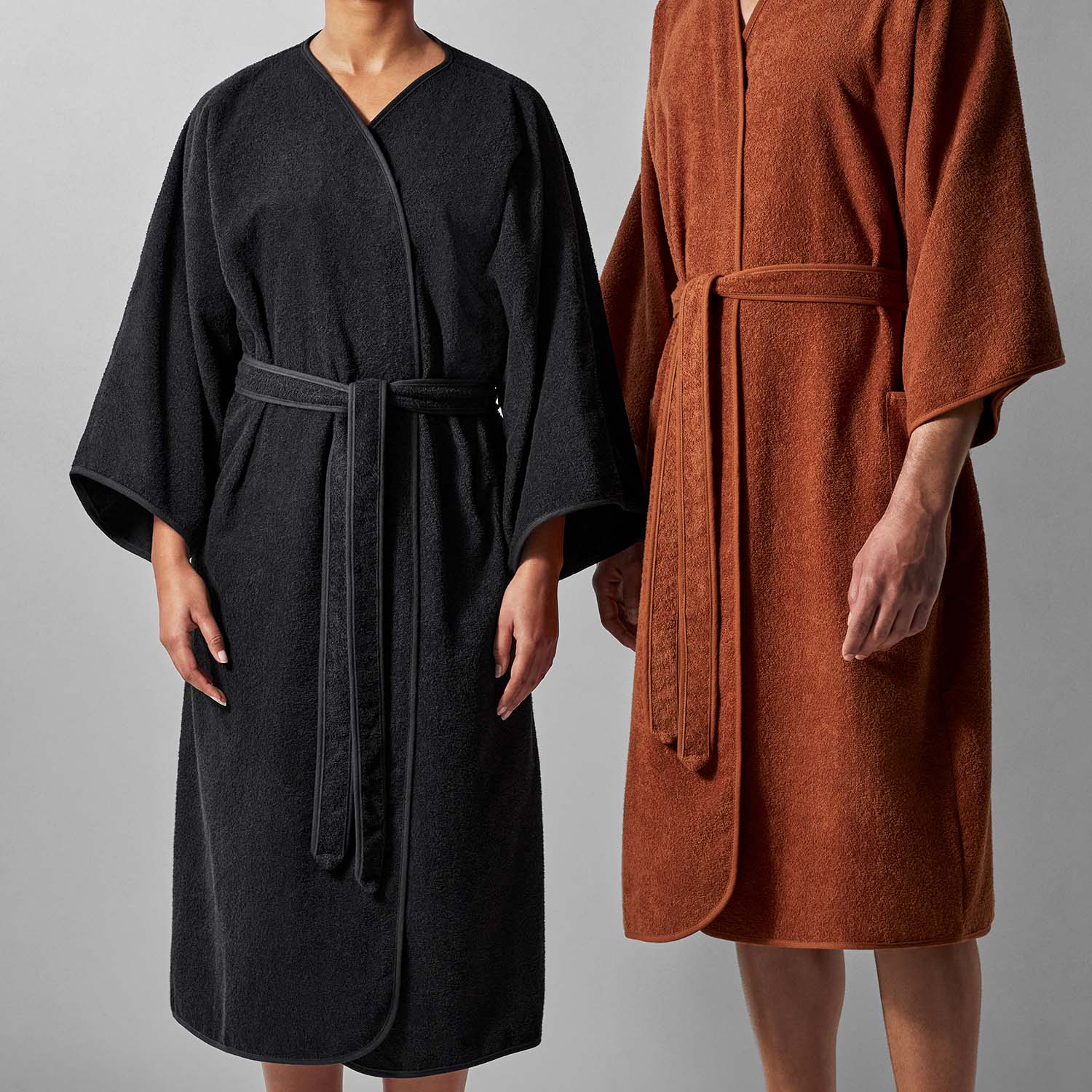 Wabi Sabi black and orange robes showcasing minimalist design and timeless craftsmanship.