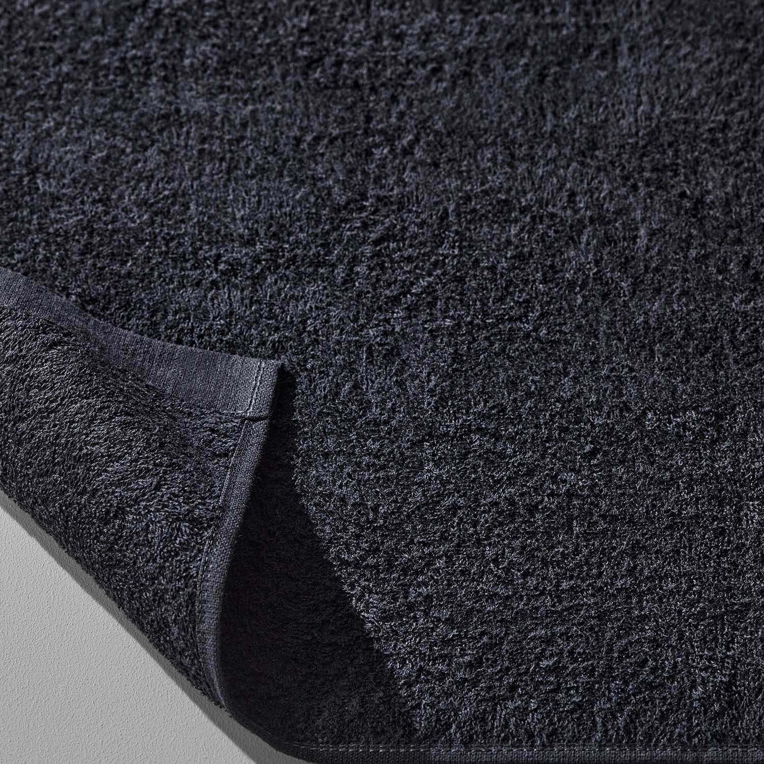 Wabi Sabi Black Towel showcasing minimalist design and luxurious texture, emphasizing elegance and sustainability.