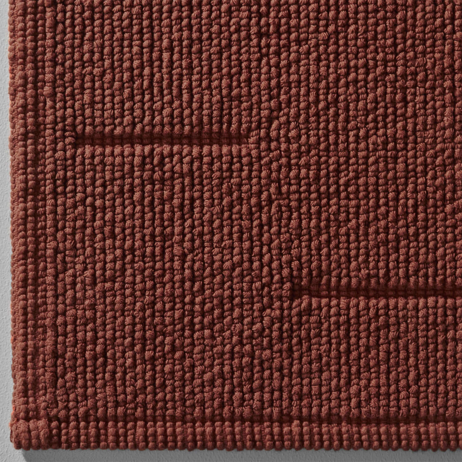 Wabi Sabi tub mat in copper featuring natural textures inspired by Japanese minimalist design.