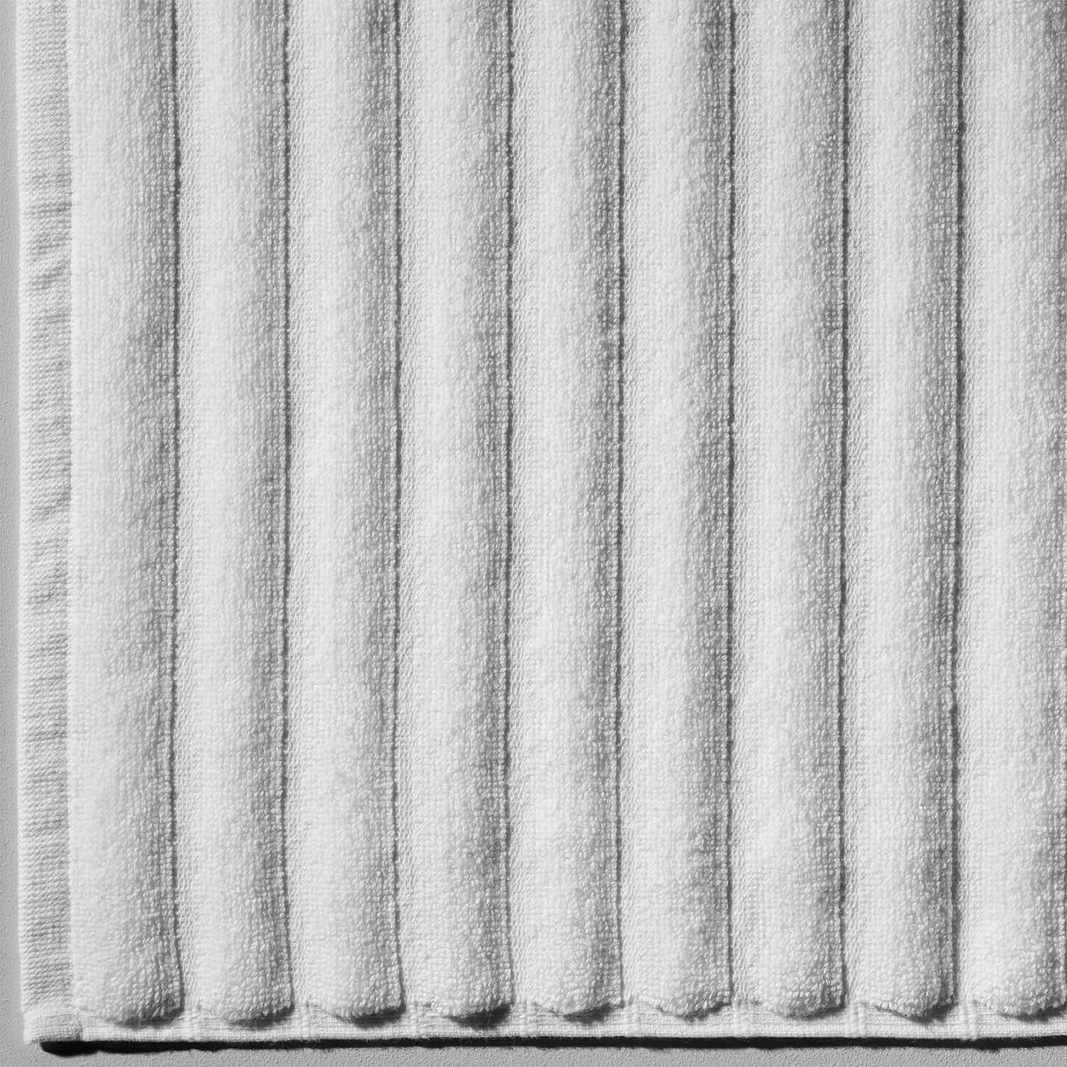 Wave Mat in soft cotton texture, featuring a luxuriously sculptured design perfect for safety in bathrooms.