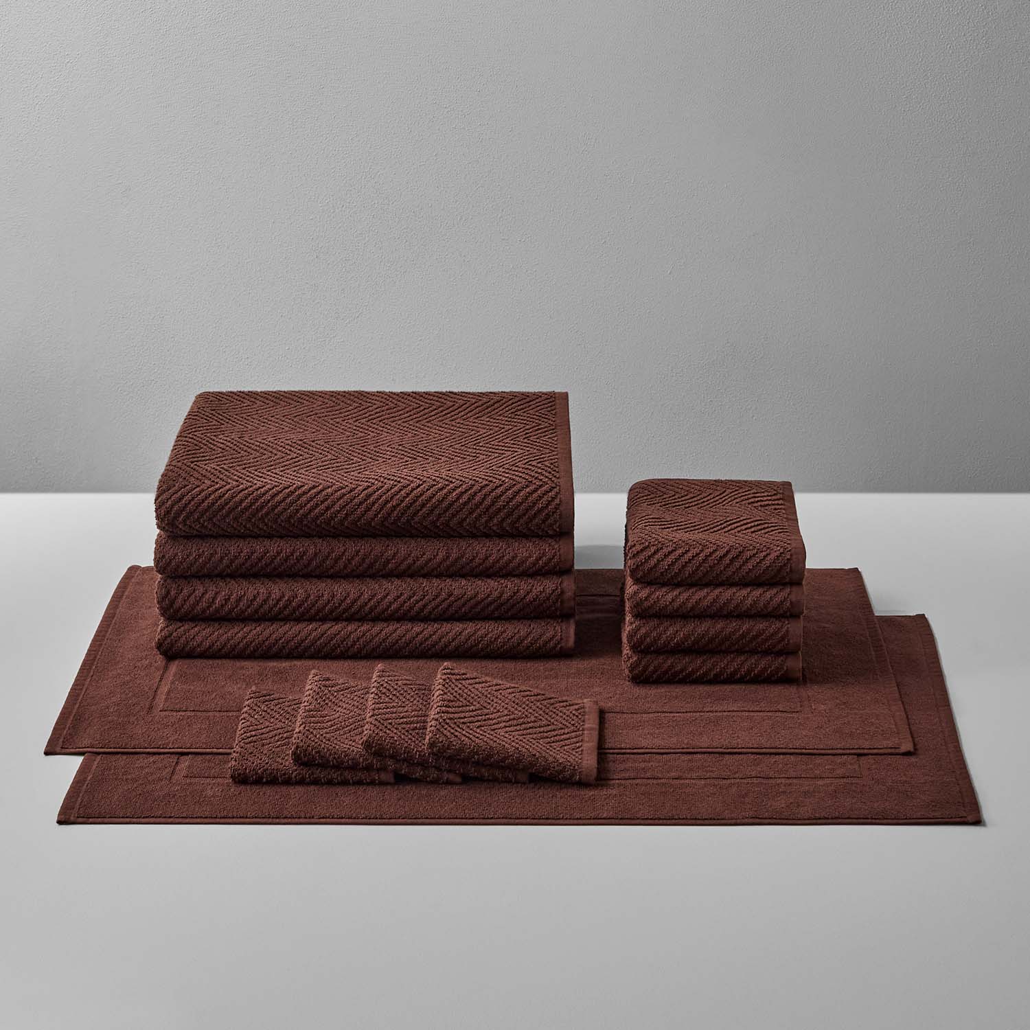 Treatment Bath Bundle Bruno featuring warm earthen tones and textured towels for ultimate relaxation and comfort.