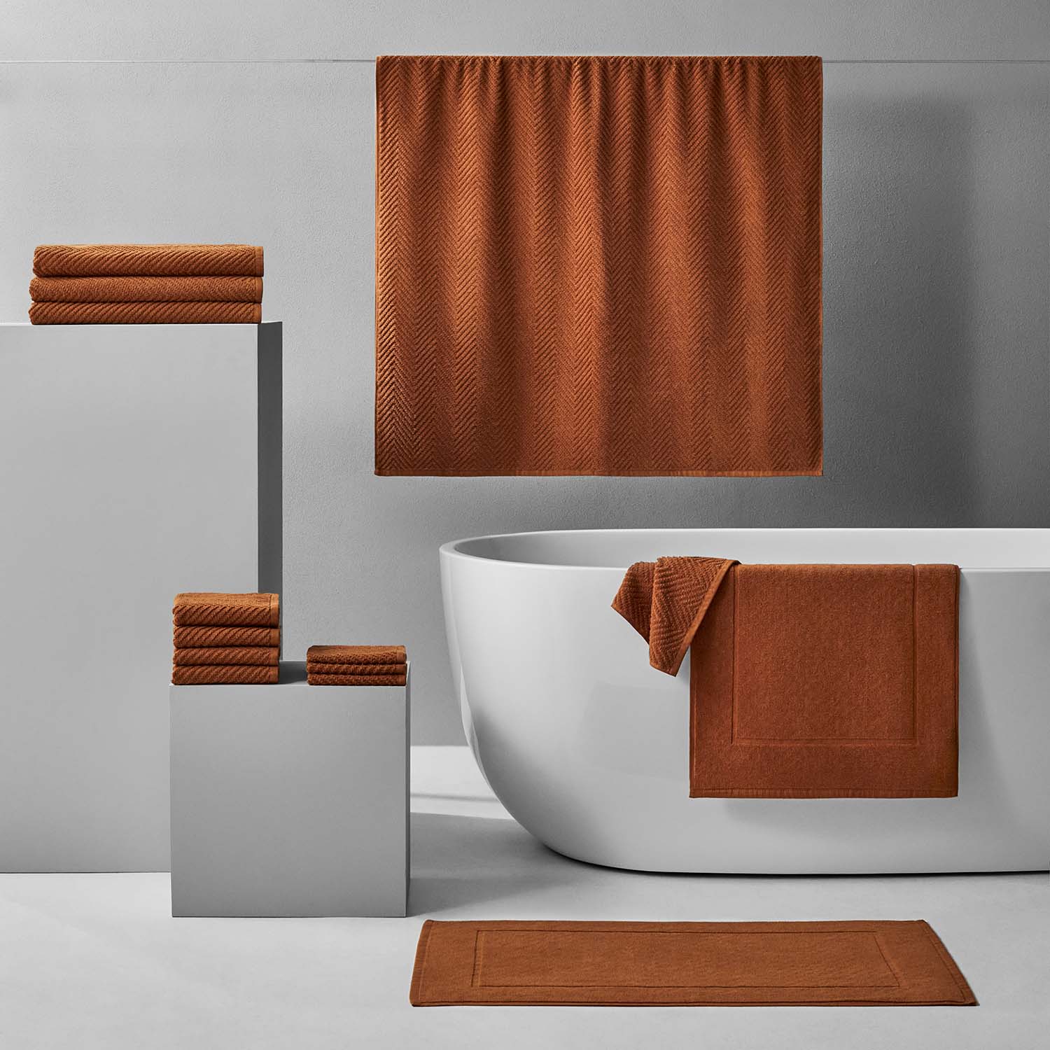 Elegant Treatment Bath Bundle in warm earthy tones, featuring soft textures and stylish towels for a serene bathroom decor.