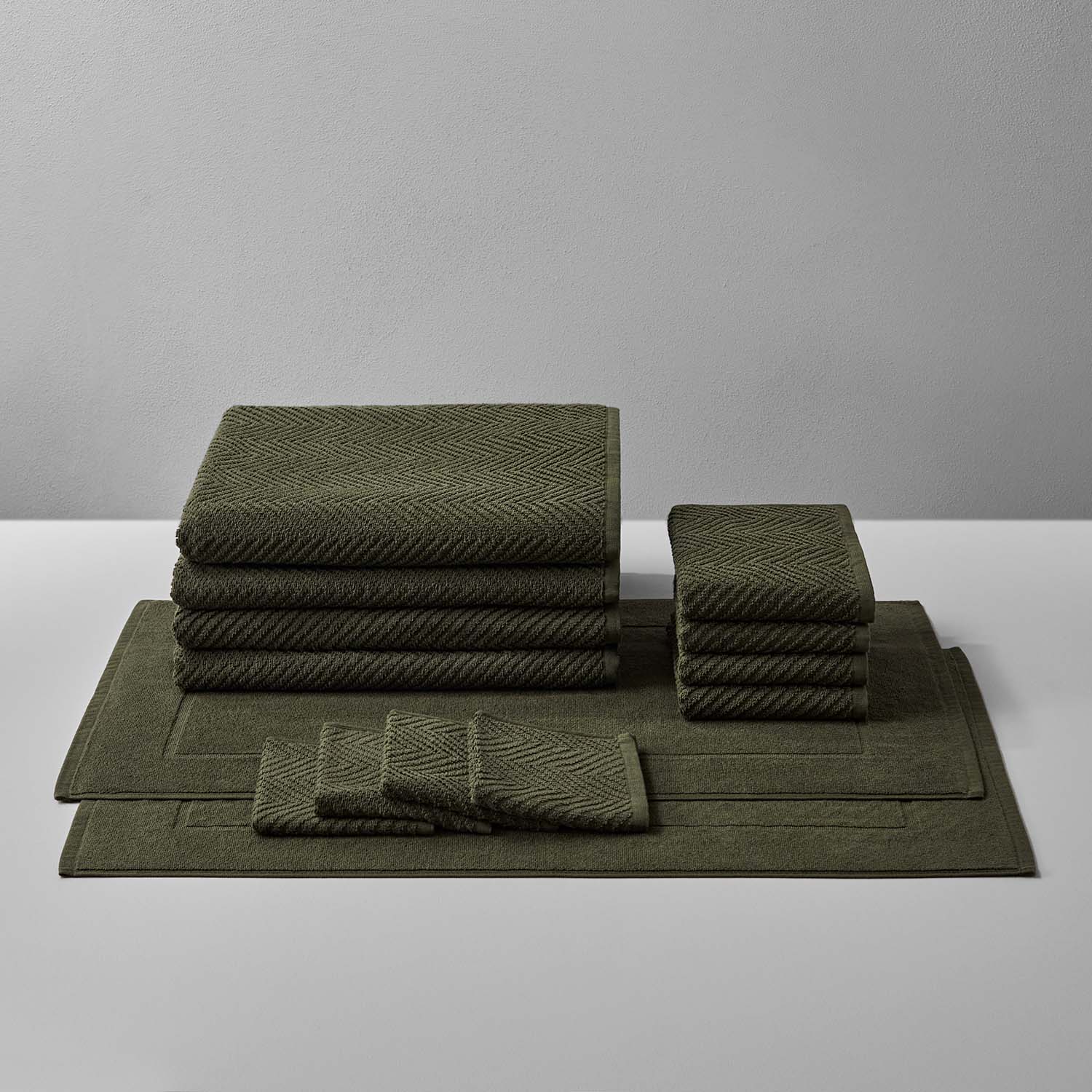 Treatment Bath Bundle in Olive with soft, durable towels and mats for ultimate care and relaxation.